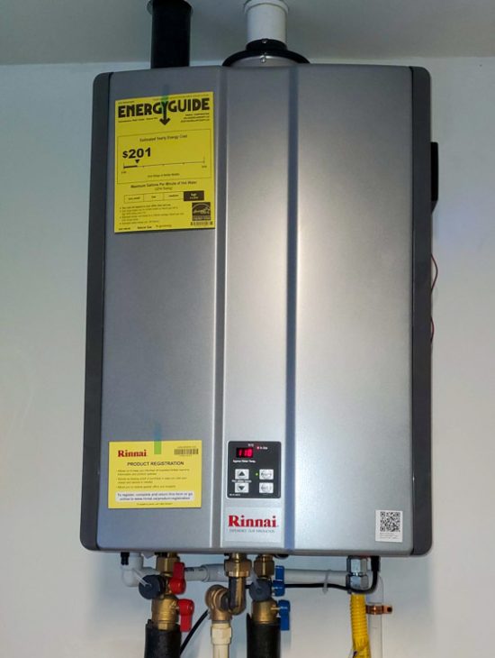 Advanced Residential Tankless Water Heater A residential tankless water heater installed neatly on the wall, complete with energy efficiency details and modern plumbing connectivity.
